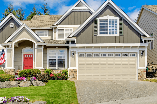 garage door home with American flag